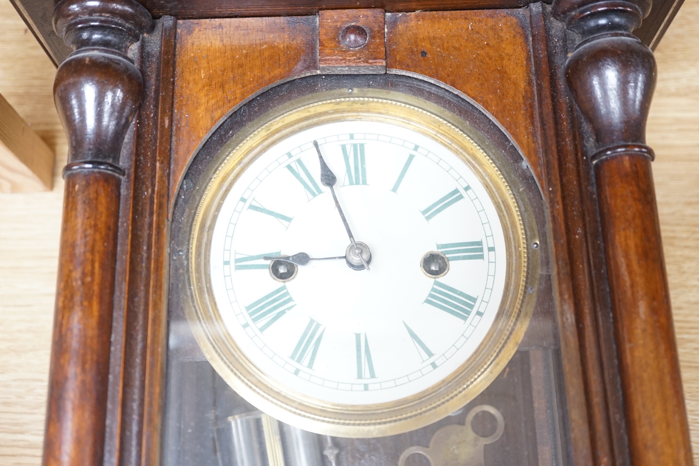 A small mahogany Vienna wall clock, 57cm high